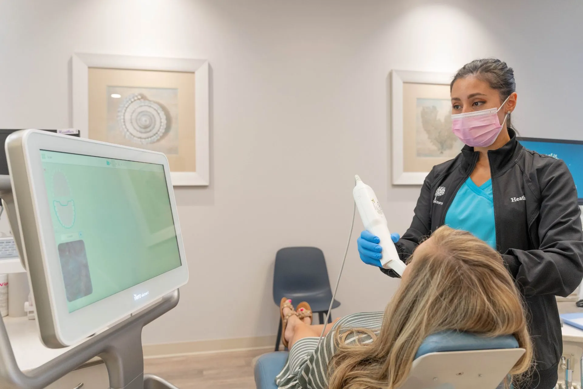 Dental professional using a digital scanner on a patient in an orthodontic office, highlighting advanced technology for Invisalign treatment at St. Johns Orthodontics in St. Augustine, FL.
